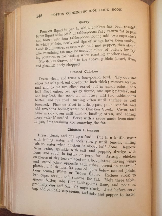 A photo of a curved book page, warped near the spine